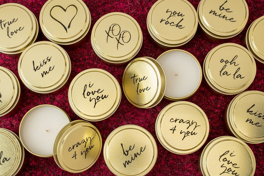 Soy blend travel candles featuring words of affection throughout the year. Each fair trade candle is hand poured by a woman refugee in the United States. Best Valentine's Day present with a give back component.