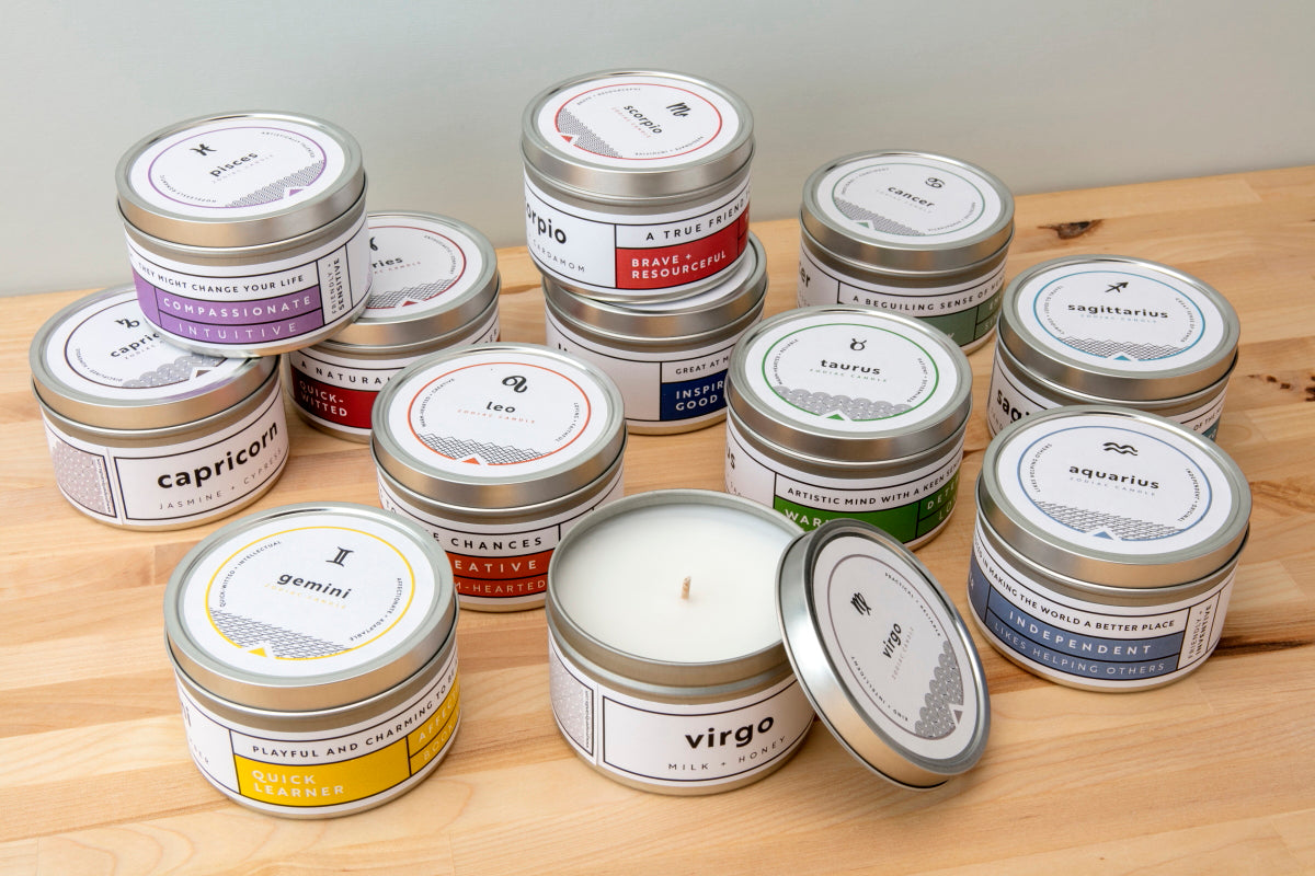 Zodiac Candles on table fair trade soy blend ethically handmade by women artisans at Prosperity Candle supporting refugees